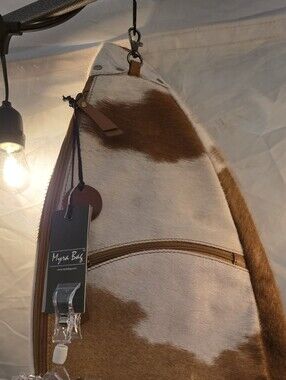 Cowhide Sling Backpack in Brown and White